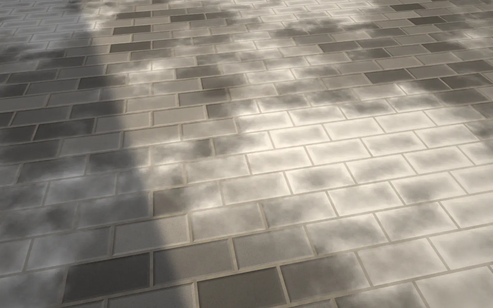 Charcoal pavers covered in white efflorescence and oil stains before professional cleaning